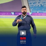 یاسین خسروی با لباس کردی و مدال طلا