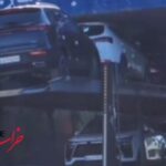 ببینید | گیر کردن تریلی حامل خودروها چند میلیاردی زیر پل ورودی گناباد